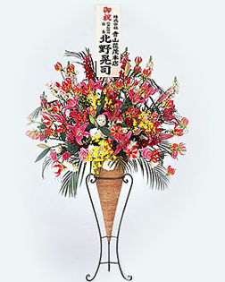 赤い色調のスタンド花