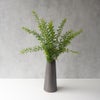 枝もの用の三角錐のようなフォルムの陶製花瓶